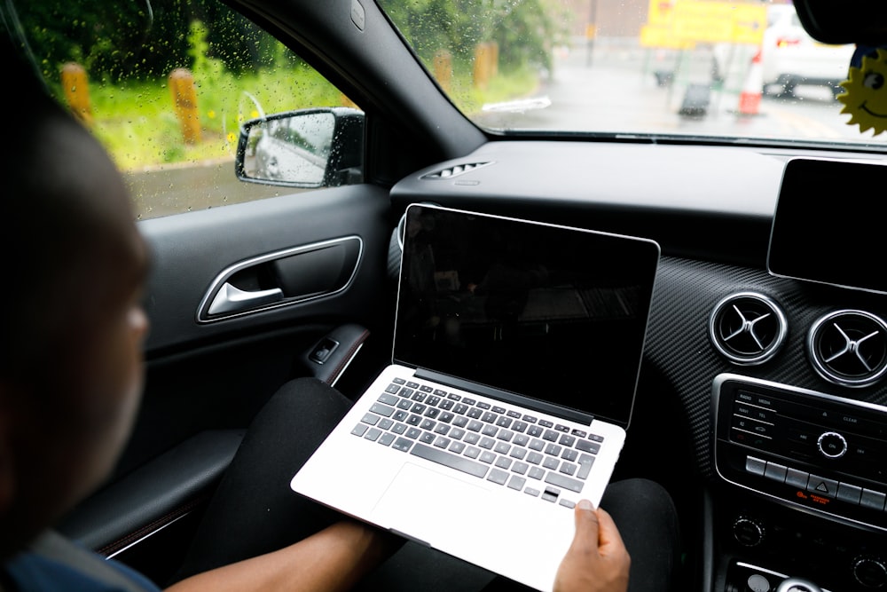 person holding MacBook