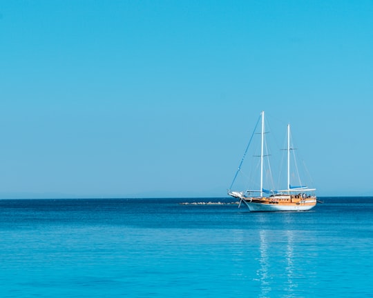 boat on body of water under blue sky at daytime in Bodrum Turkey