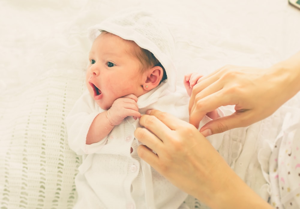 baby wearing white shirt