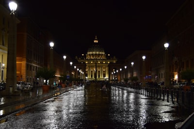 white concrete building vatican city teams background