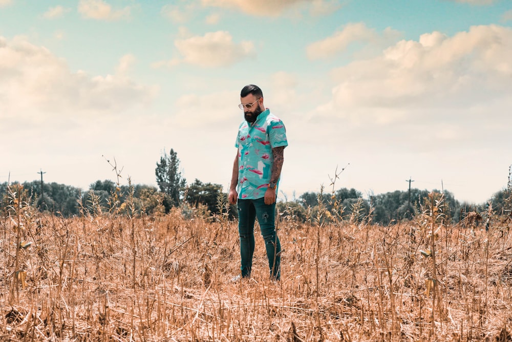 man standing near trees during daytime