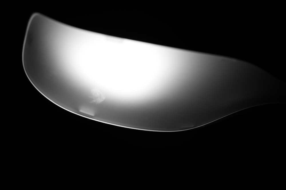 a black and white photo of a spoon