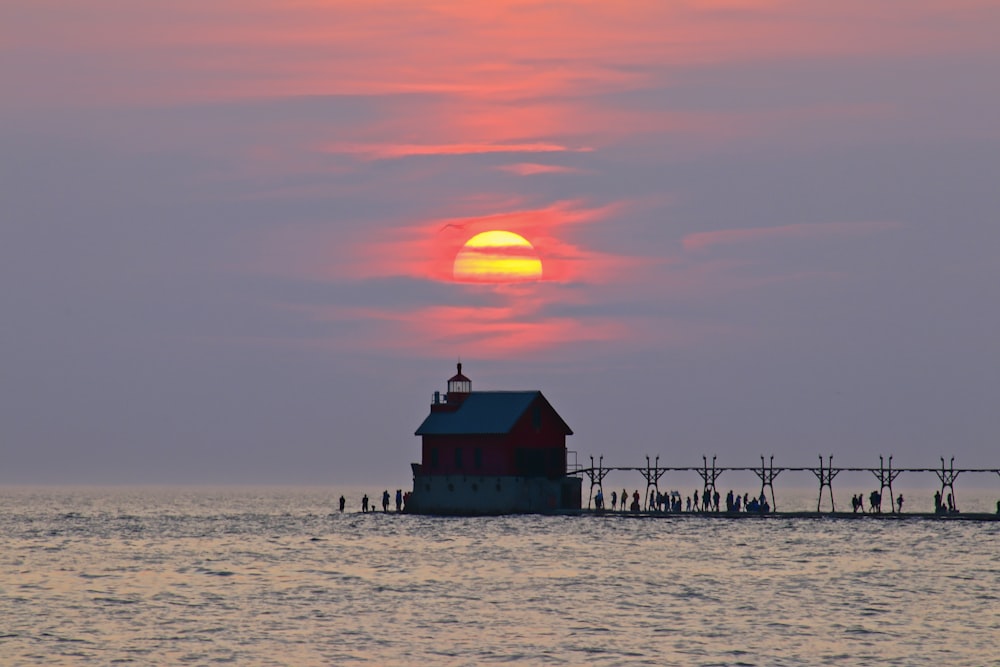 sea under clear blue sky during sunset