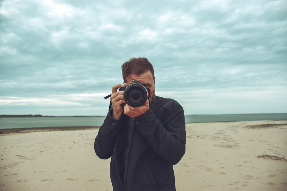 a man taking a picture of himself with a camera