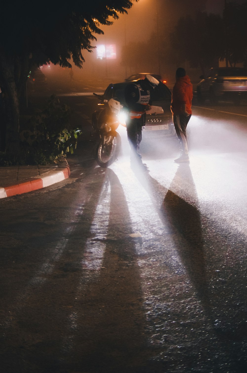 vehicle parks beside road with police officer