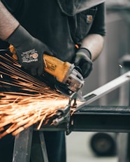 person holding angle grinder
