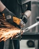 person holding angle grinder