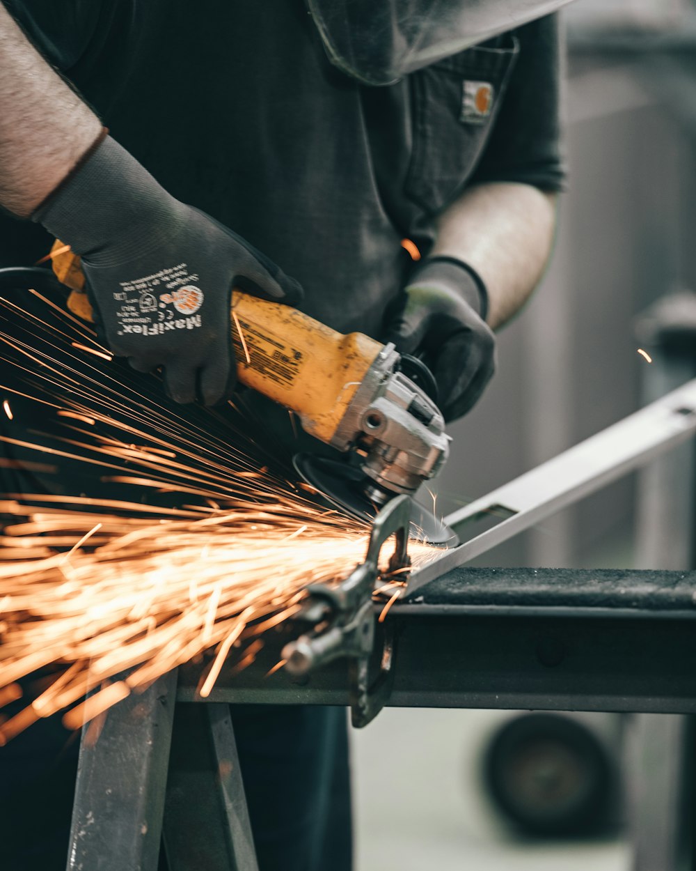 person holding angle grinder