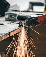 man cutting metal
