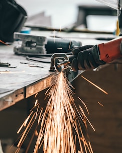 man cutting metal
