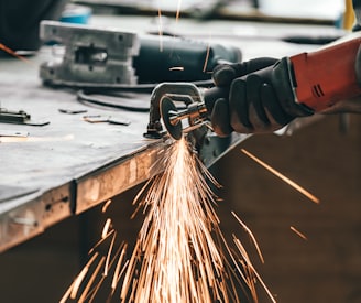 man cutting metal