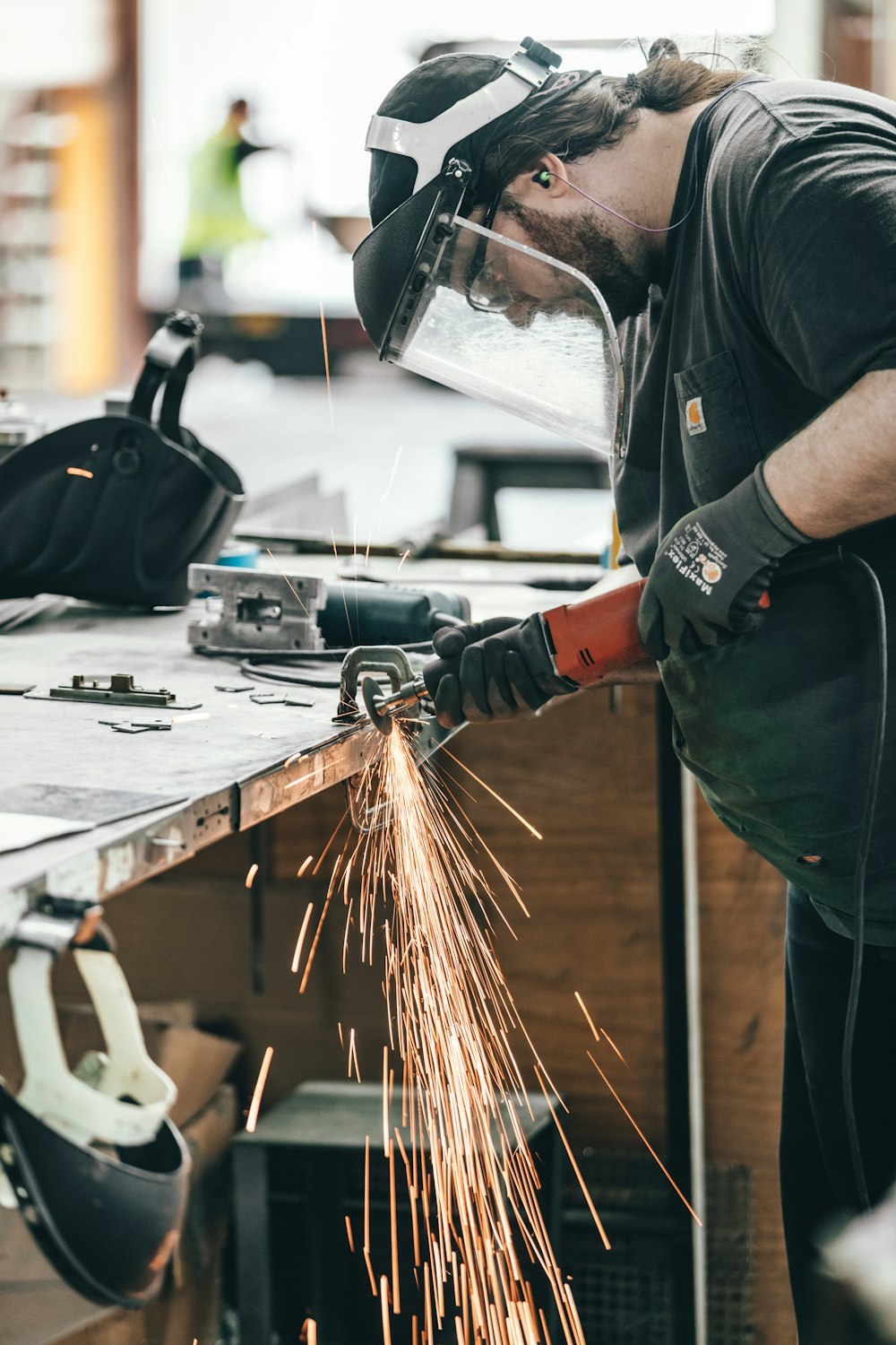 man using angle grinder