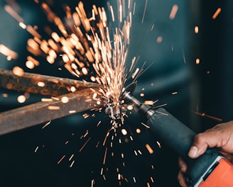 person using angle grinder