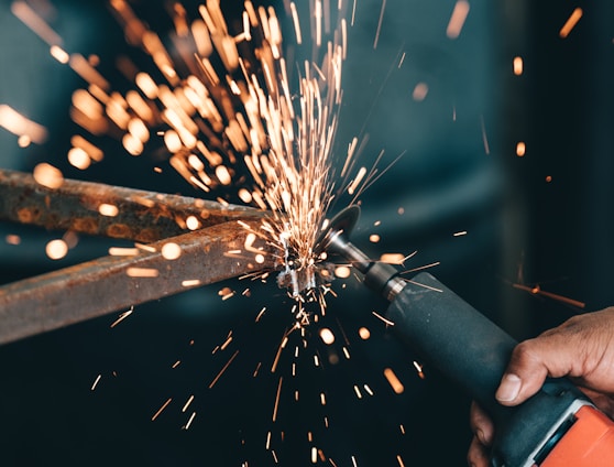 person using angle grinder