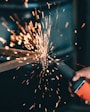 person using angle grinder