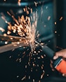 person using angle grinder
