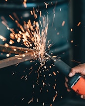 person using angle grinder