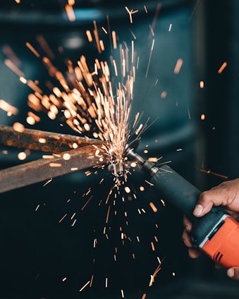 person using angle grinder