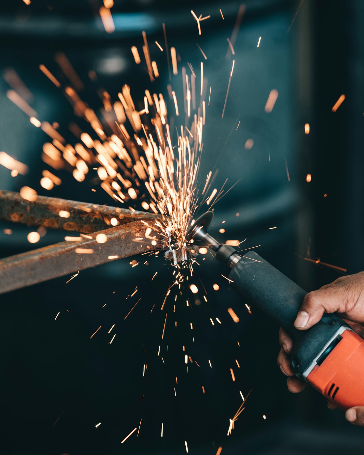 Close-up of an angle grinder detailing a metal surface