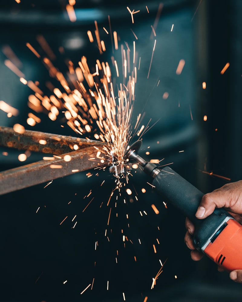 Close-up of an angle grinder detailing a metal surface
