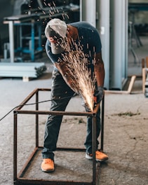 man welding frame