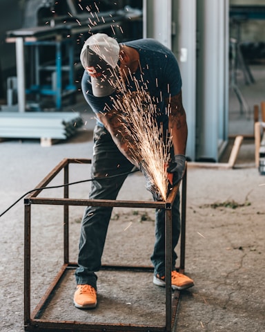 man welding frame