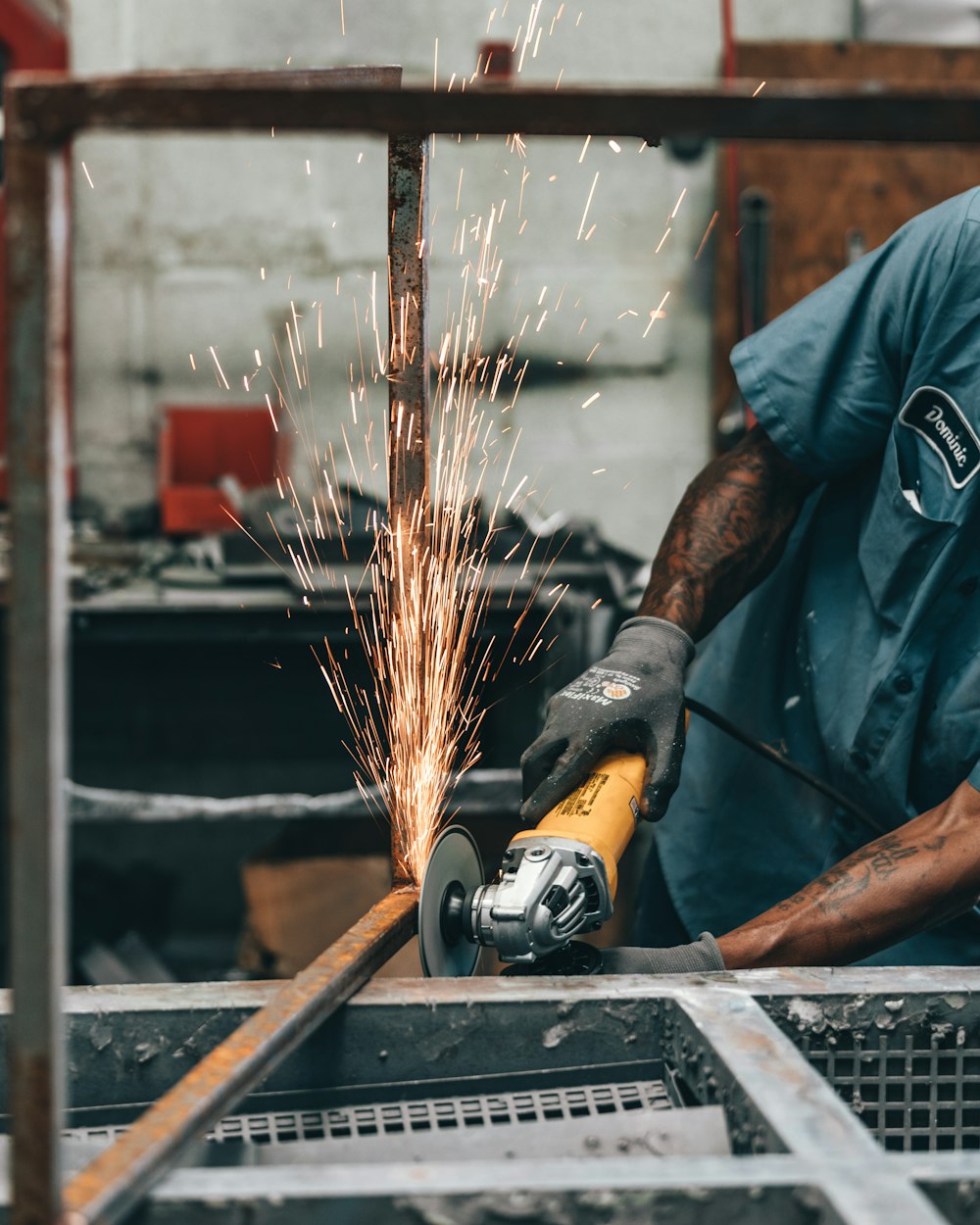 a man using a grinder on a piece of metal