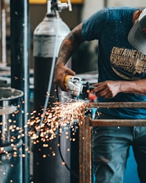 man using angle grinder