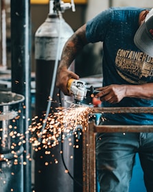 man using angle grinder