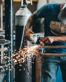 man using angle grinder