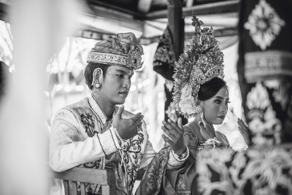 grayscale photography of groom and bridge