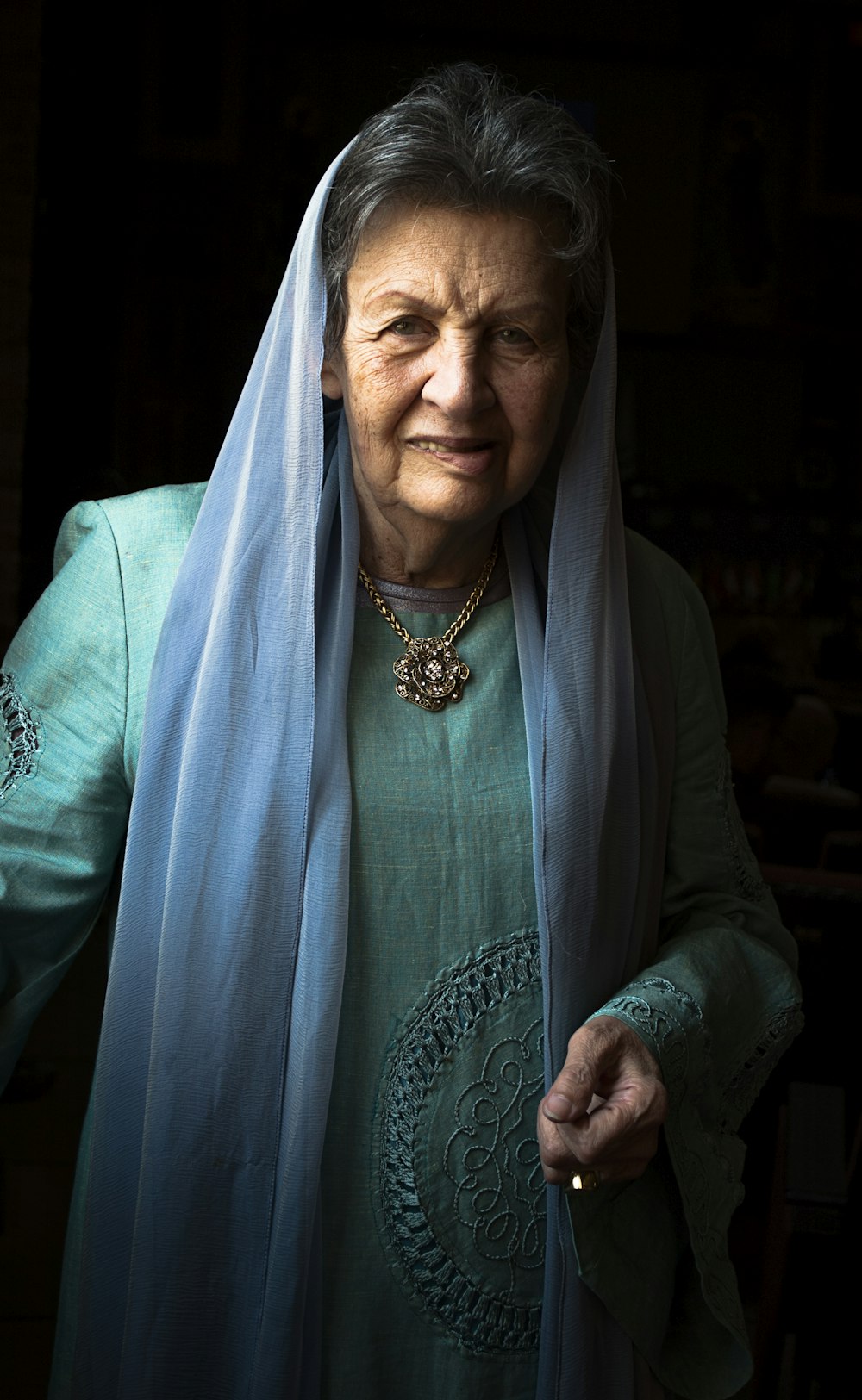 woman in blue scarf