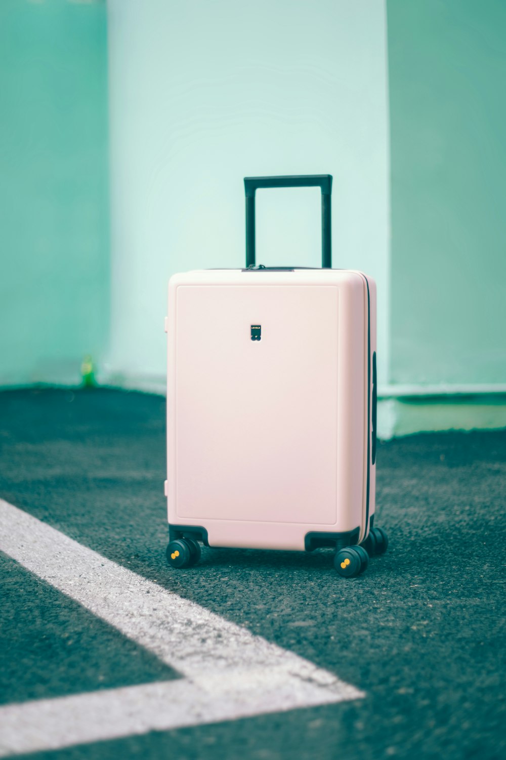 white and black luggage