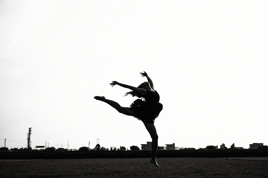 silhouette of jumping woman near outdoor