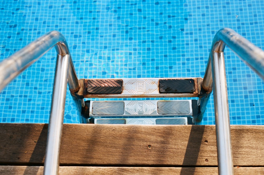 gray metal pool ladder
