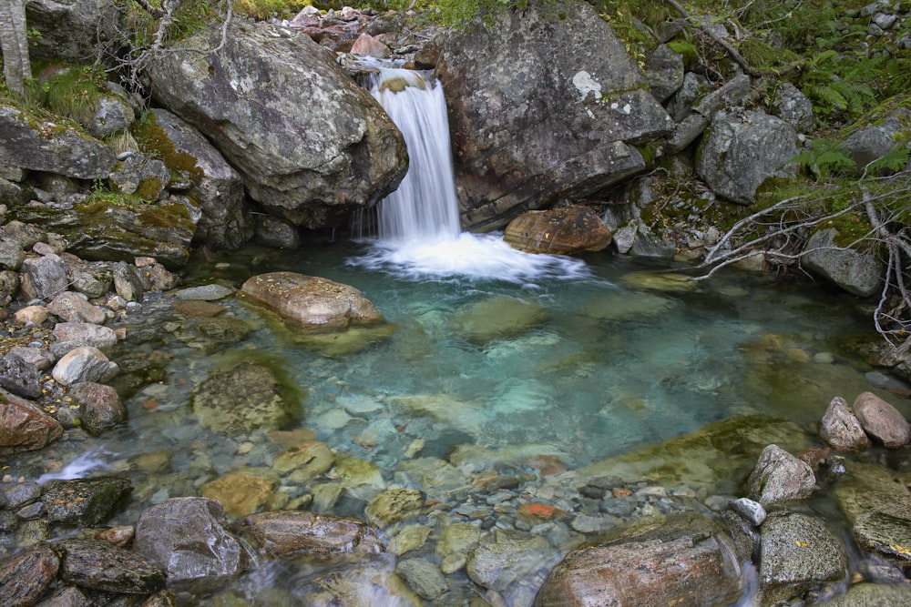 waterfalls in rocky pond