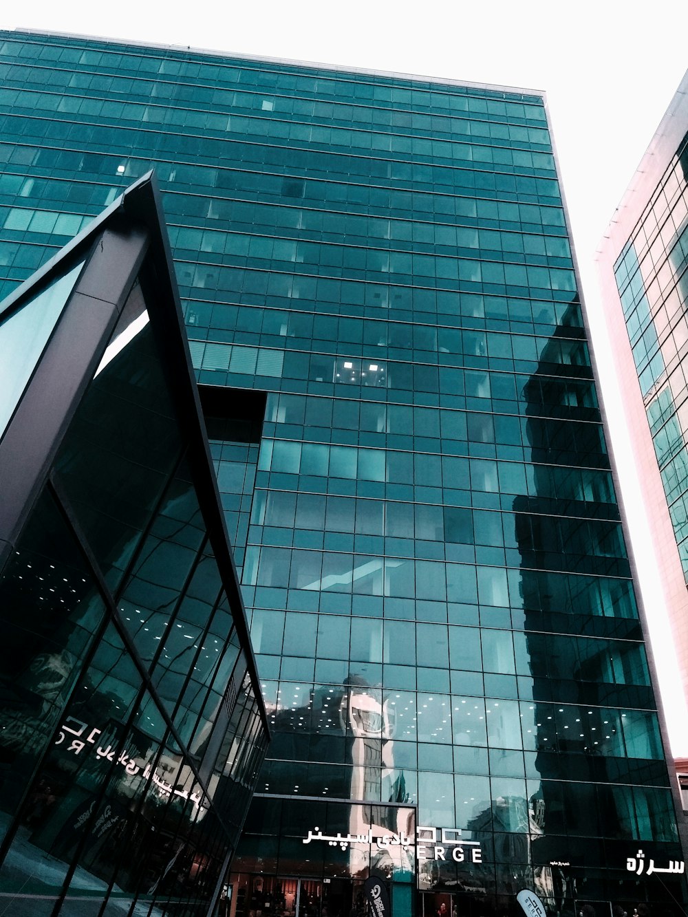 green glass facade high rise building