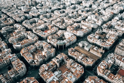 aerial photo of brown and white city buildings