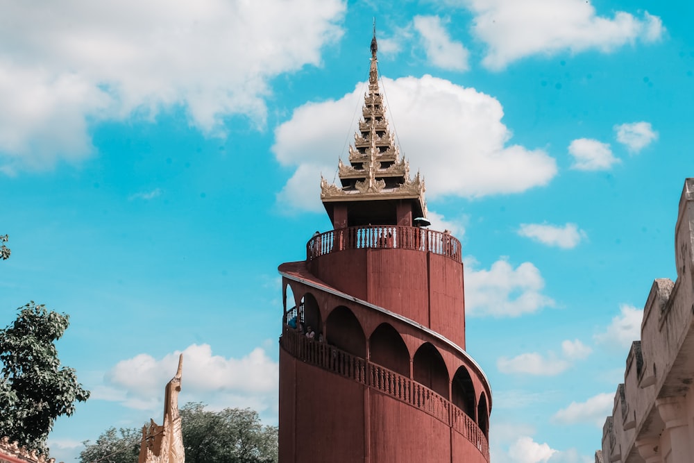 red and brown tower at daytime