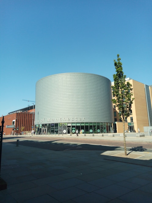 Modern office building with a sign displaying JD Lancaster Ltd, located in Radcliffe, Manchester.