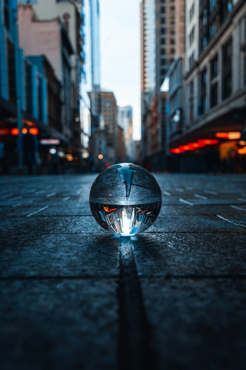 clear glass ball on road during nightime