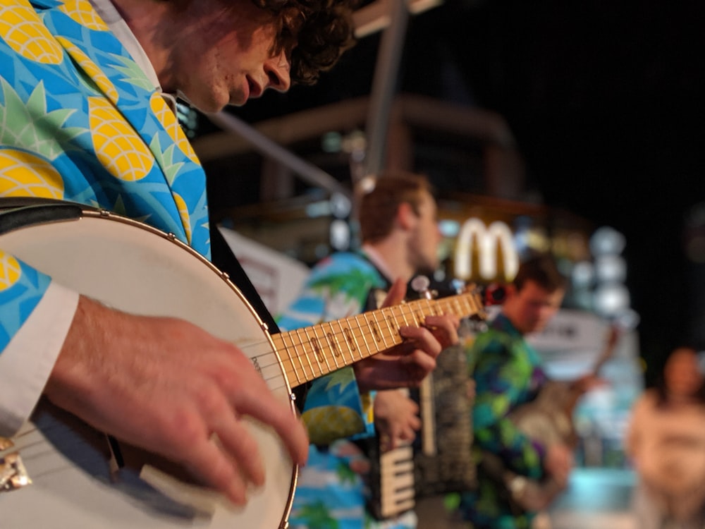 man playing banjo