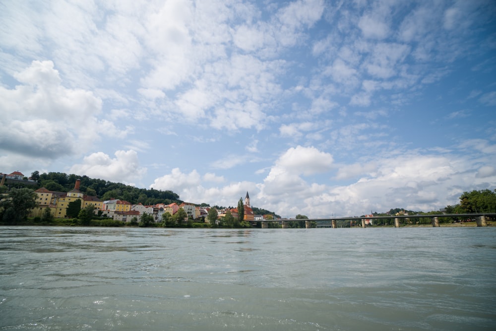 photography of buildings beside body of water during daytime