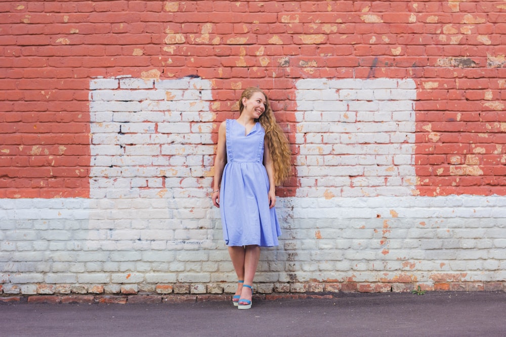 woman leaning on wall