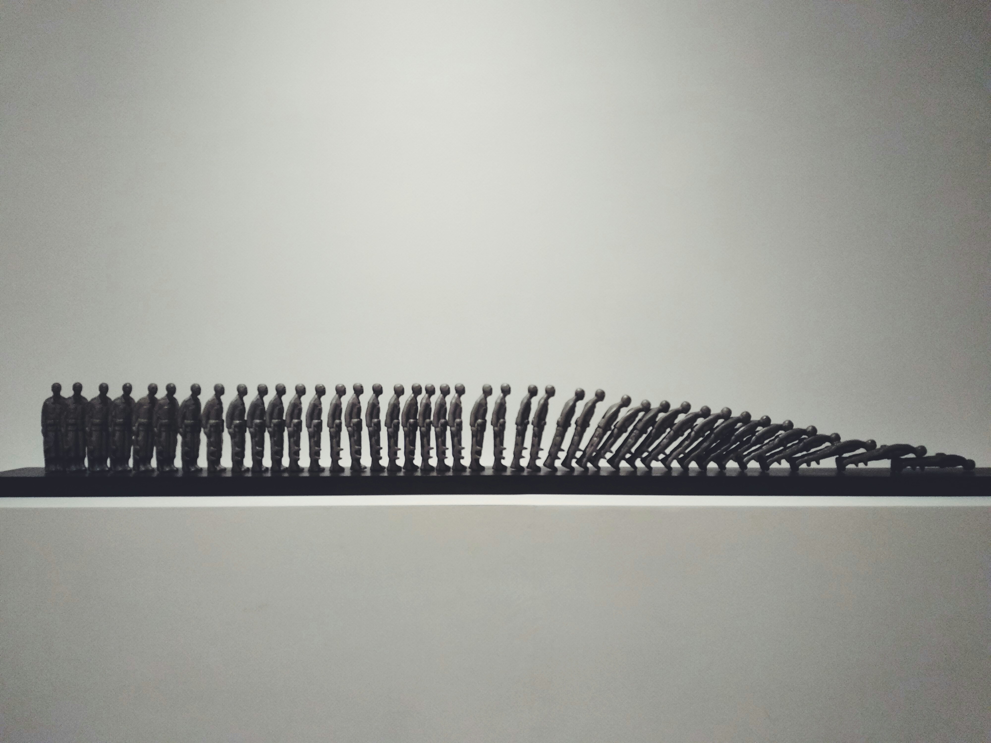 a large group of small black objects on a table