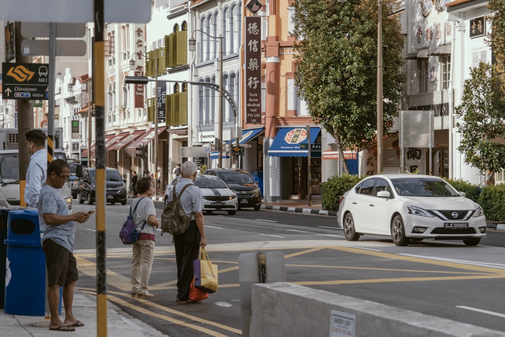 people standing on road during daytime