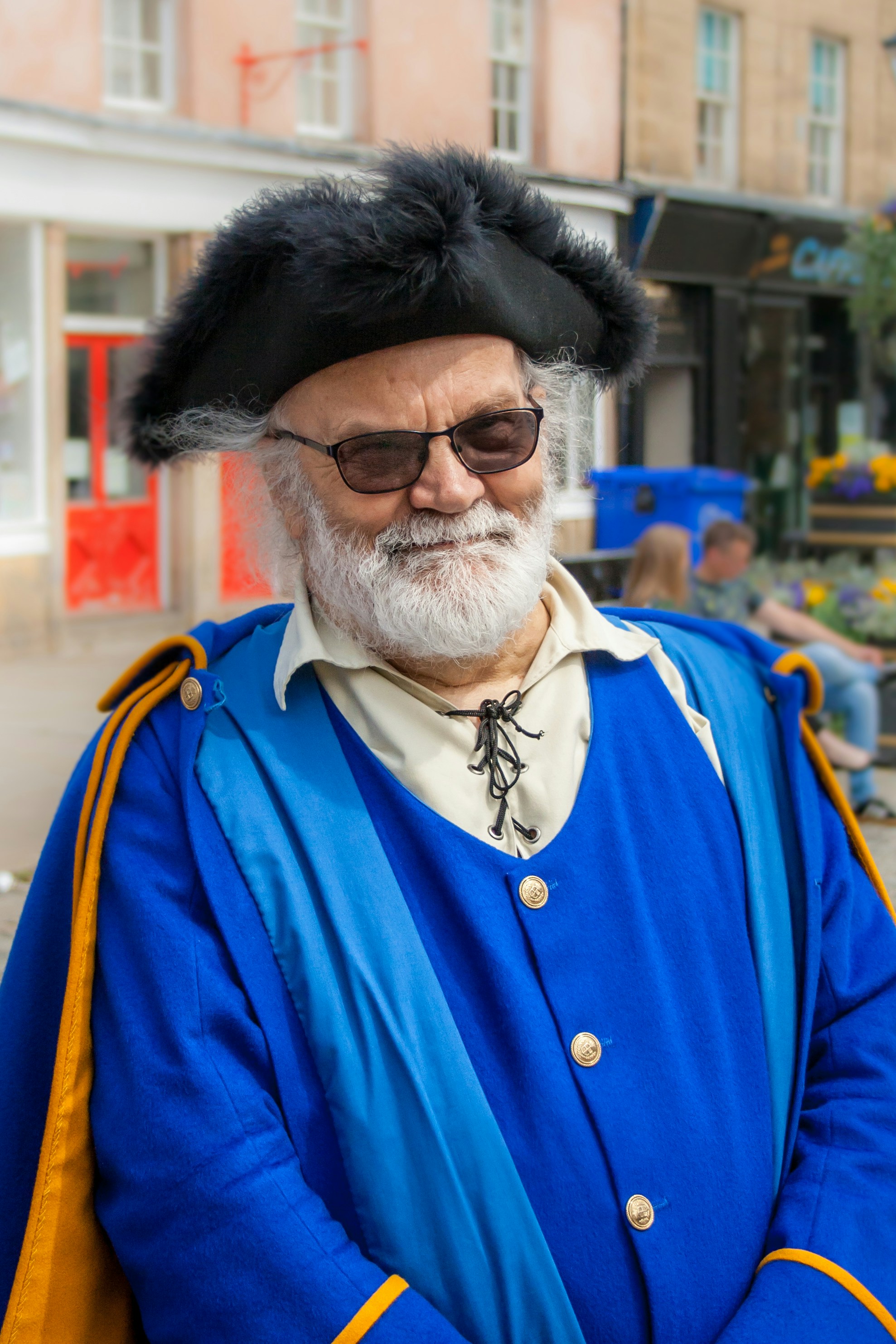 smiling man in blue otp