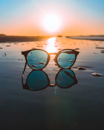 black framed teal lens sunglasses during daytime