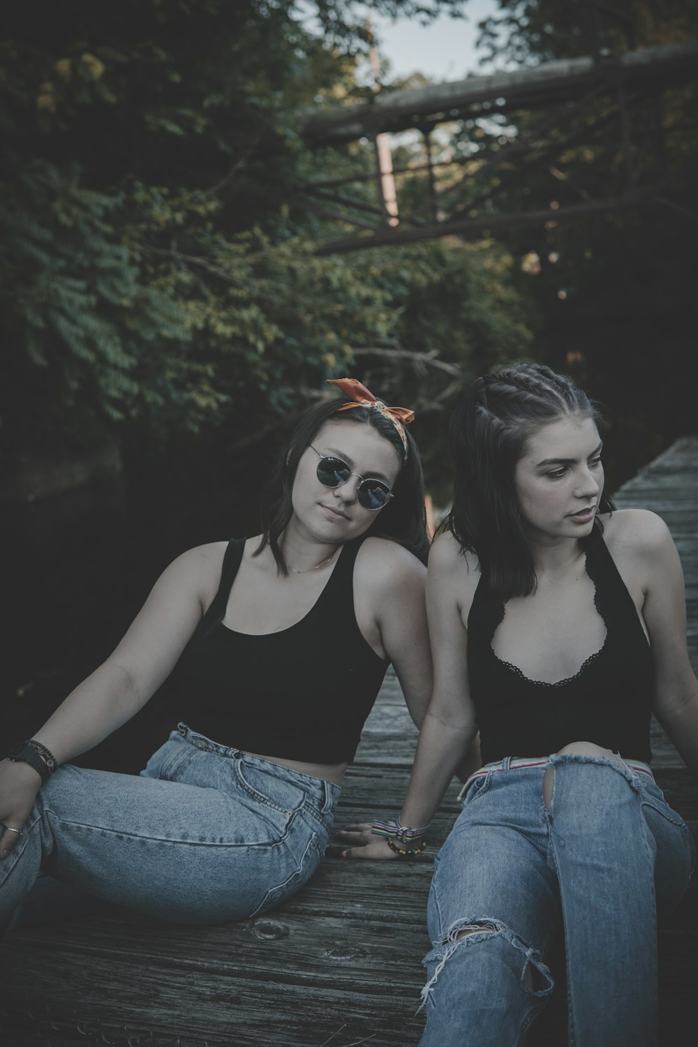 women sitting on dock