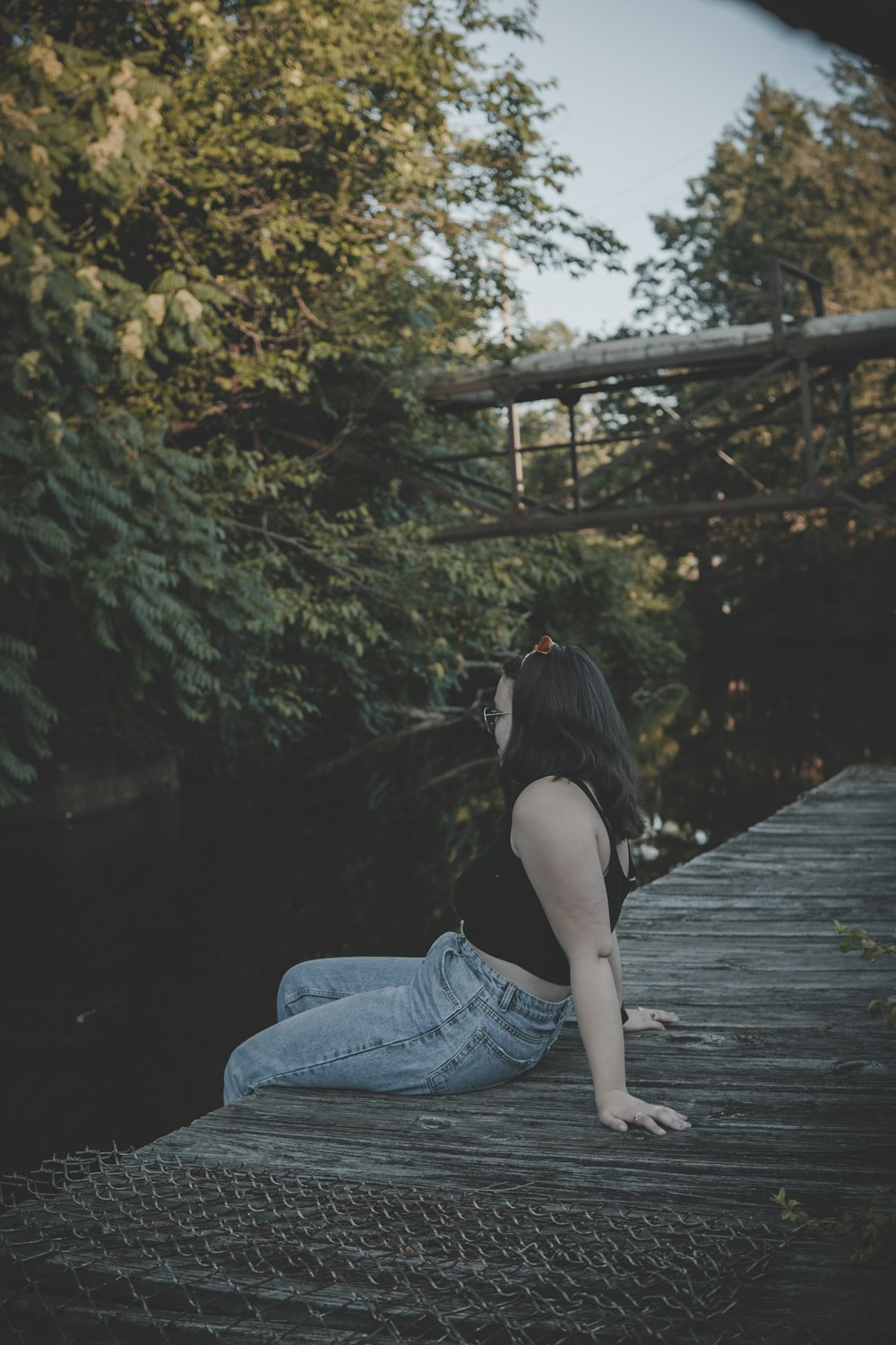 woman sitting on brown wooden sock